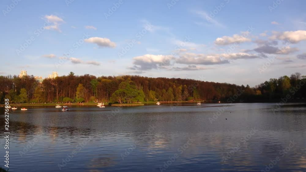 Beautiful view of the lake with boats and catamarans in the park Beautiful view of the lake with boats and catamarans in the park