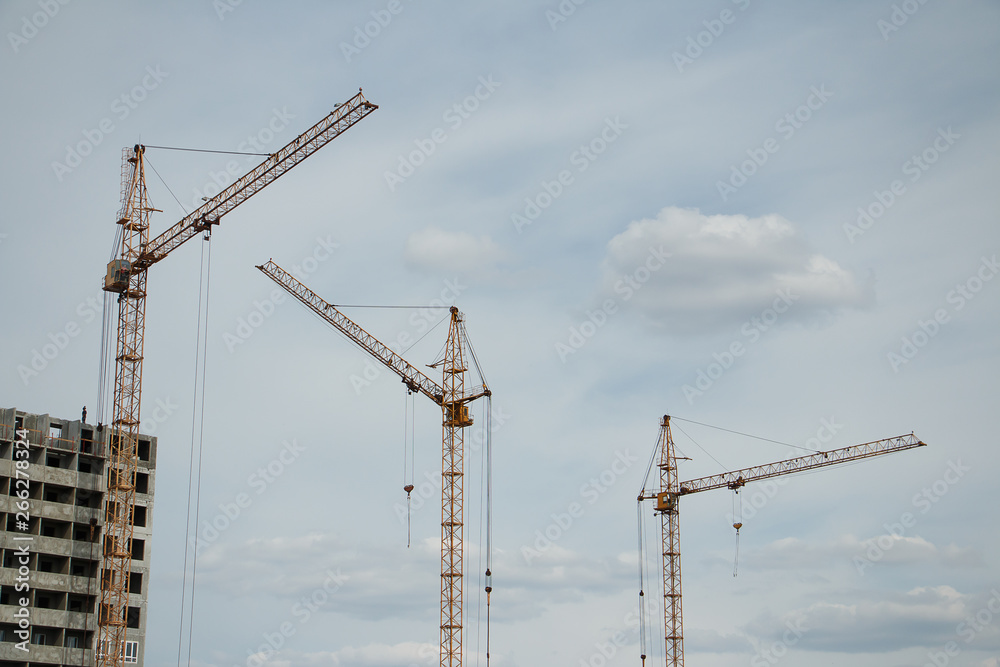 cranes in construction and building houses