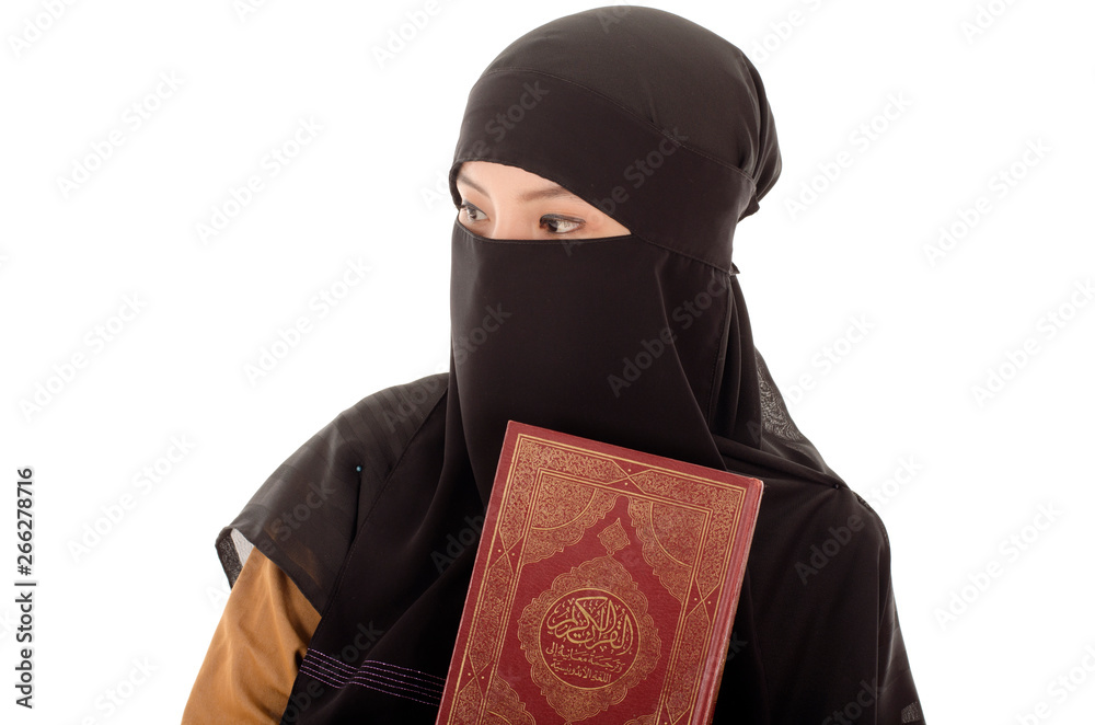Portrait of a beautiful Muslim Arabic girl reading Al Quran Portrait of a beautiful Muslim Arabic girl reading Al Quran