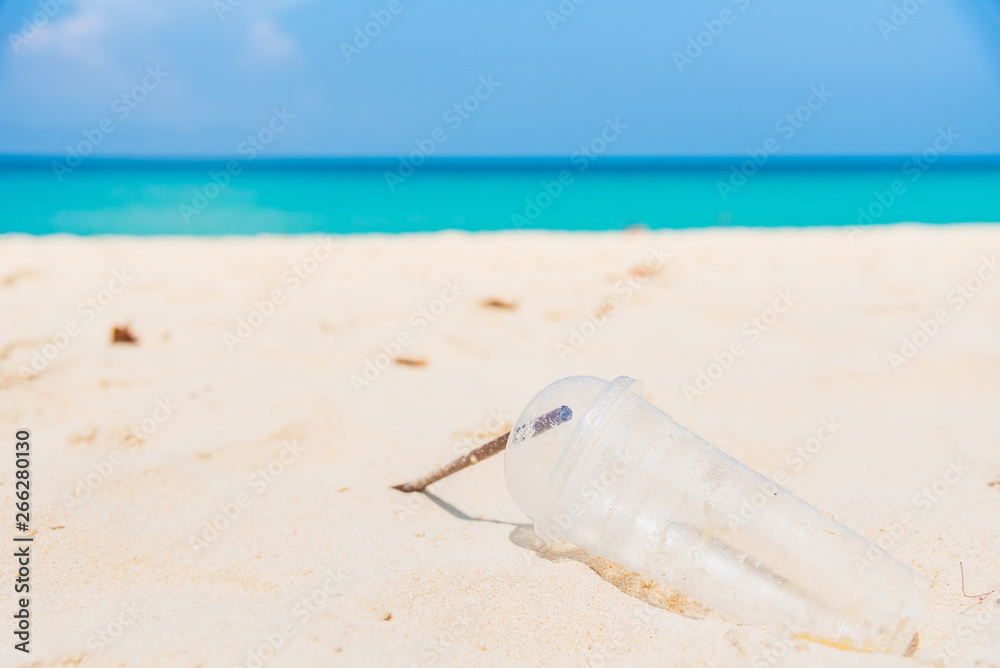 Obraz premium Glass and plastic tube, garbage on the beach thailand.