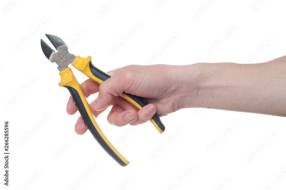 Man's hand holding a black and yellow wire cutter. Open, clean, ready to cut form. Man's hand holding a black and yellow wire cutter. Open, clean, ready to cut form.