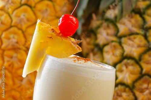 The Pina Colada is a sweet cocktail made with rum, coconut cream or coconut milk, and pineapple juice. It may be garnished with either a pineapple wedge, maraschino cherry, or both.