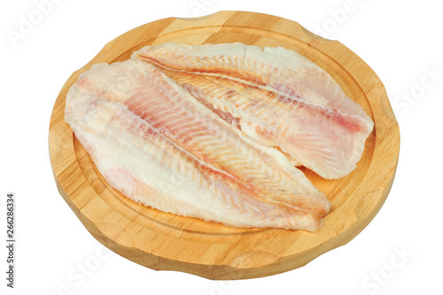 Pangasius fillet meat on a board on white isolated background