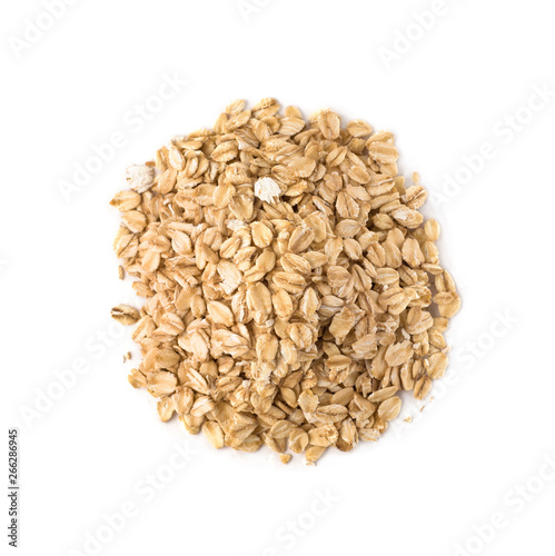 Top view of raw oat flakes pile. Oatmeal isolated on white background
