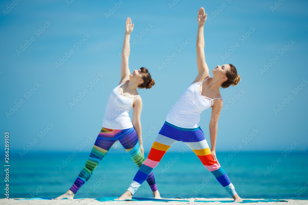 Obraz premium Portrait of a gorgeous young woman practicing yoga. The concept of a healthy lifestyle. Sport.
