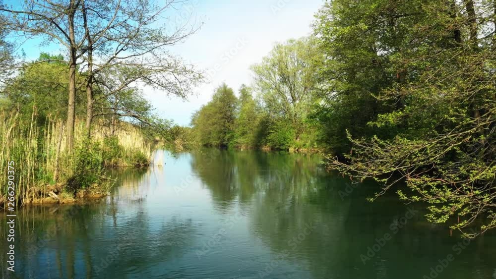 Mreznica river in Croatia, beautiful nature countryside landscape, low flight with drone over the warter surface Mreznica river in Croatia, beautiful nature countryside landscape, low flight with drone over the warter surface