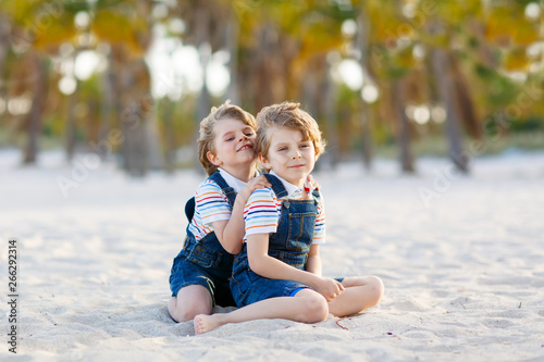 Two little kids boys having fun on tropical beach © Irina Schmidt