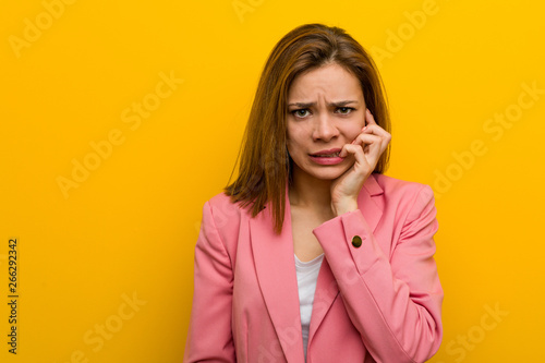 Young fashion business woman biting fingernails, nervous and very anxious. photo