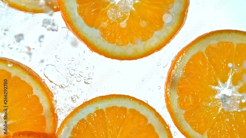 Super Slow Motion Shot of Splashing Orange Slices at 1000fps. Super Slow Motion Shot of Splashing Orange Slices at 1000fps.