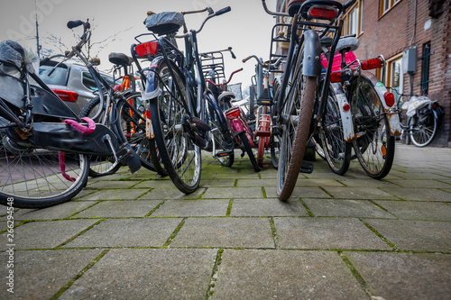 chaotically parked abondoned bicycles on the streets of the Netherlands