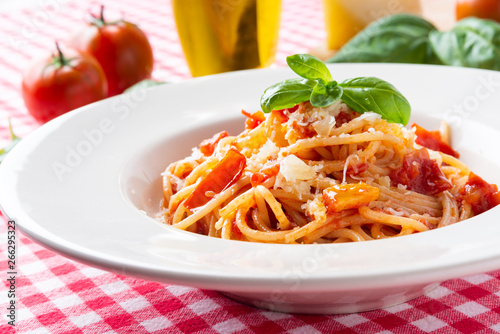 Spaghetti with tomato sauce, cheeese and fresh basil