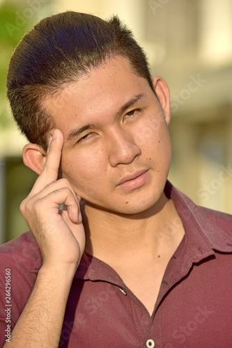Handsome Filipino Male Decision Making © dtiberio