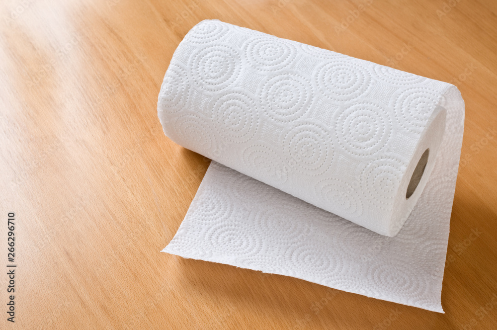 Fototapeta premium Paper towel roll on wooden the table.