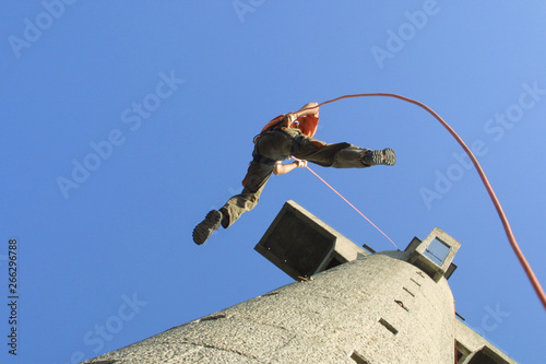 Tableau sur toile Abseiling also known as rappelling, is a controlled descent off a vertical drop, such as a rock face, using a rope