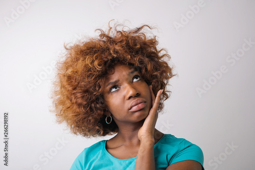 Pretty Afro woman wondering