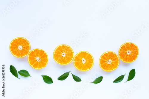 High vitamin C  Orange fruits with leaves on white background.