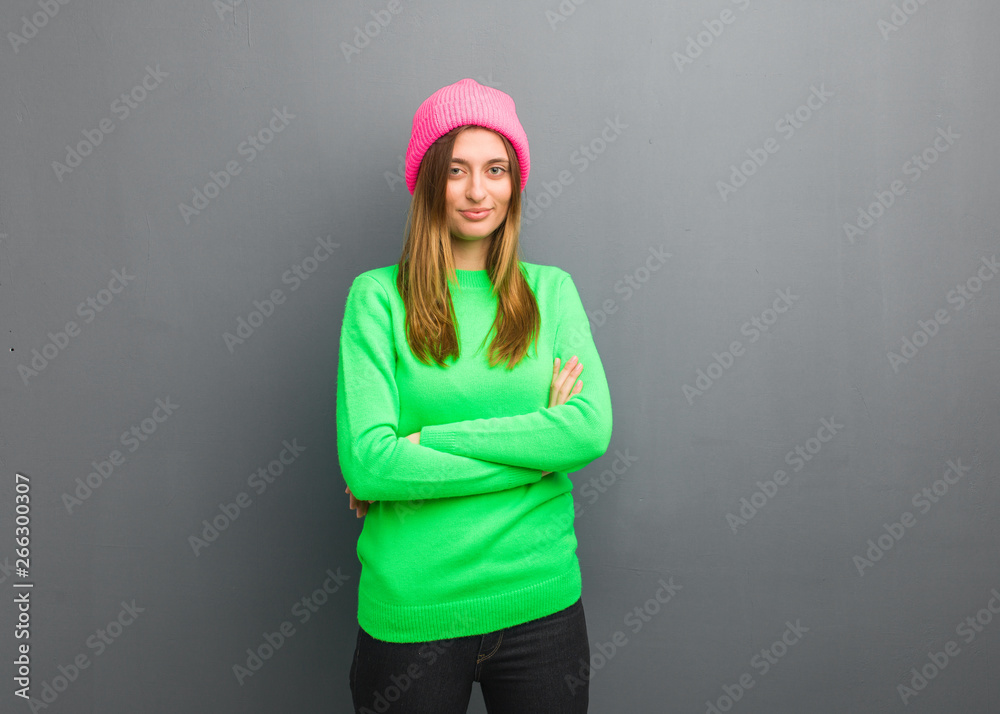 Young natural russian girl crossing arms, smiling and relaxed