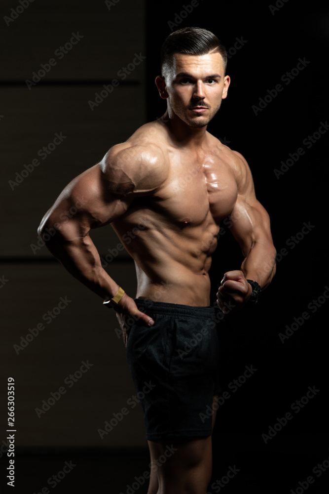 Bodybuilder Performing Side Chest Pose Stock Photo | Adobe Stock