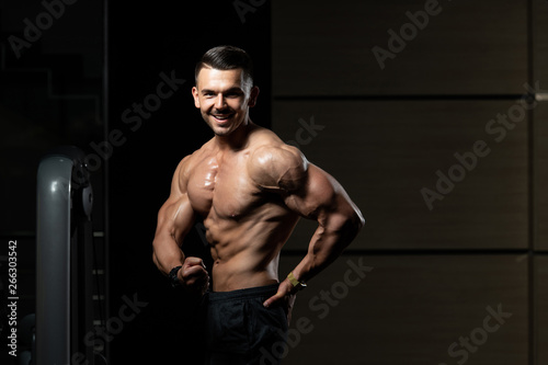 Handsome Body Builder Making Side Chest Pose
