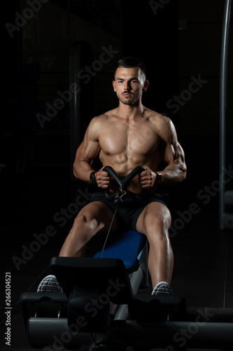 Muscular Man Doing Heavy Weight Exercise For Back