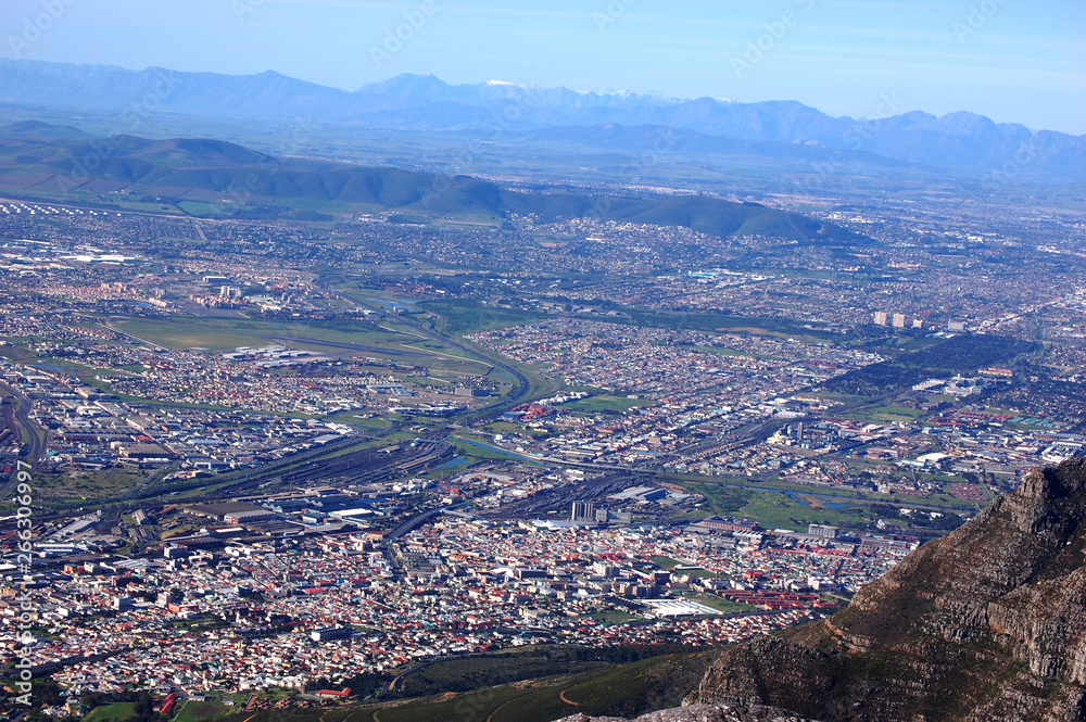 View on the city from Table Mountain, South Africa, Cape Town, with the ocean and mountains and the sky View on the city from Table Mountain, South Africa, Cape Town, with the ocean and mountains and the sky