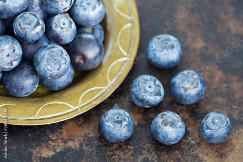 Healthy eating, blueberries natural antioxidant fruits, snack foods on metal grunge background