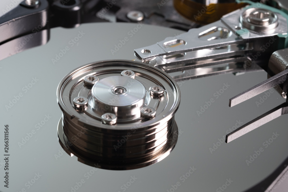 Hard drive from the computer hdd with mirror effect. Close-up, macro, on a white background. And repair tools. Hard drive from the computer hdd with mirror effect. Close-up, macro, on a white background. And repair tools.