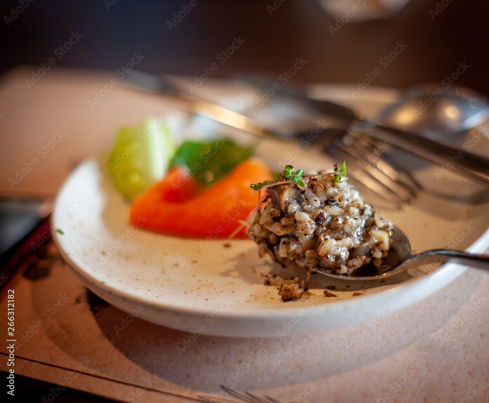 Dish delicious Black Truffle Risotto . Traditional Italian risotto Blending with Truffle mushrooms and cheese top Luxury menu .