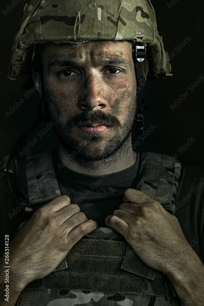 Only one chance to be alive. Close up portrait of young male soldier. Man in military uniform on the war. Depressed and having problems with mental health and emotions, PTSD, rehabilitation. Only one chance to be alive. Close up portrait of young male soldier. Man in military uniform on the war. Depressed and having problems with mental health and emotions, PTSD, rehabilitation.