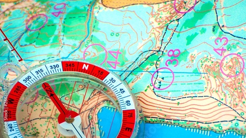 Orienteering. Compass and topographic map. Navigation equipment for orienteering. The concept. photo