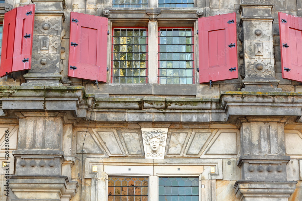 Naklejka premium Details of the external facade of the Town Hall (rebuilt in 1629) in Delft, Netherlands, with carvings