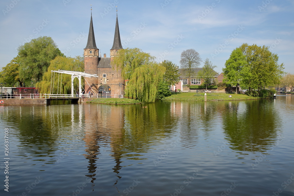 The Eastern Gate (Oostpoort), reflected on Schiekanaal in Delft, Netherlands