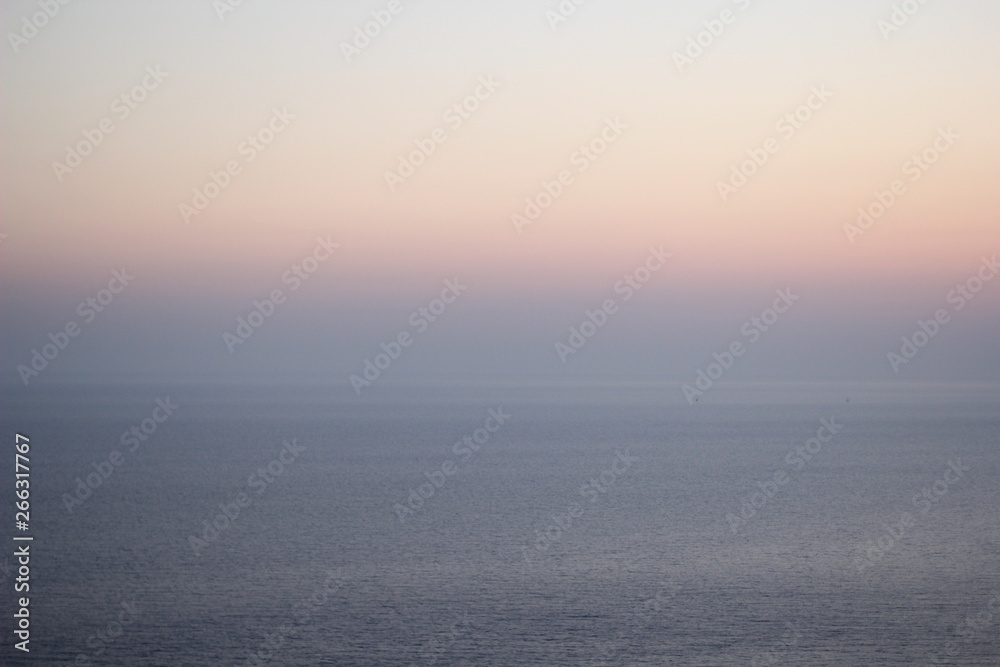 The sky and the sea at sunset. Skyline. Beautiful tones. Background