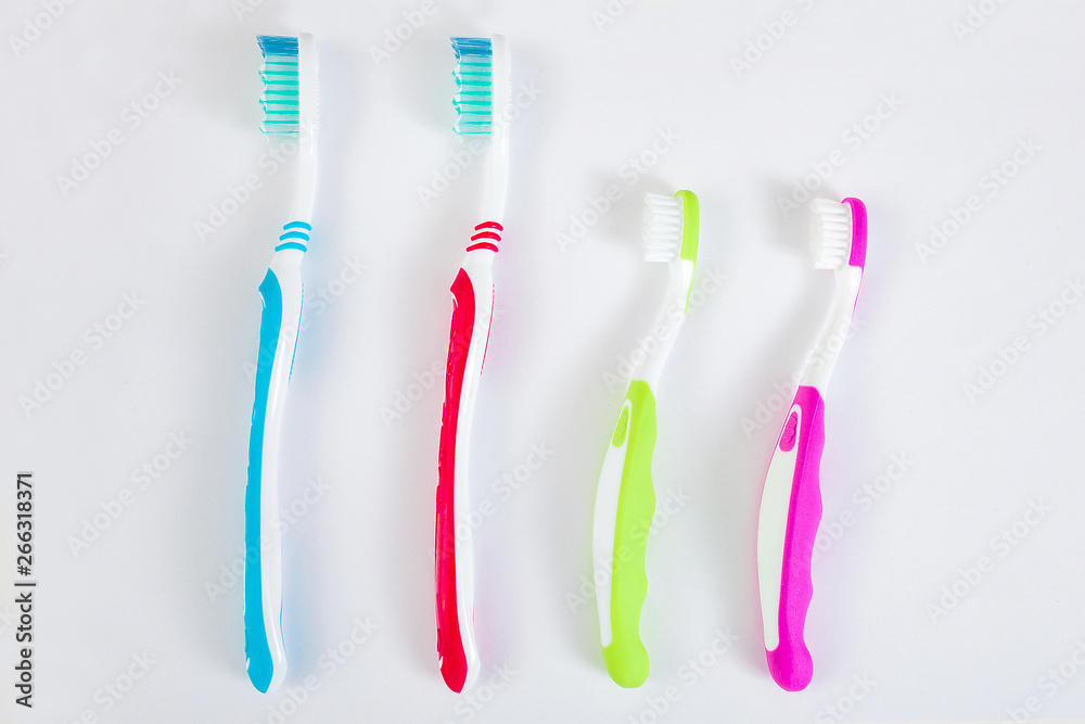Toothbrushes on neutral background. Family hygiene concept.