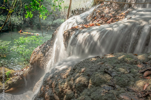 Soft water in natural obsessions invite. Pure, refreshing green forests. At Pha Taek waterfall, Khao Laem national park, Kanchanaburi in Thailand. photo