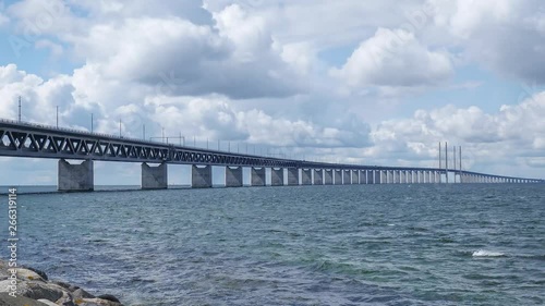 Timelapse Oresundsbron with blue sky and white clouds.