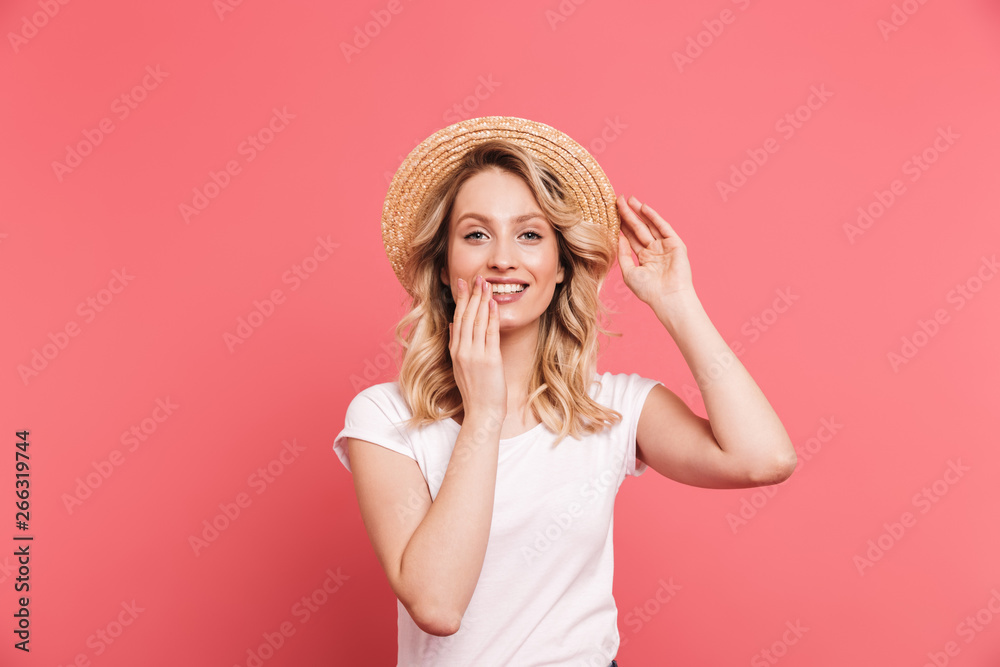 Portrait of stylish blond woman 20s wearing straw hat smiling at camera Portrait of stylish blond woman 20s wearing straw hat smiling at camera