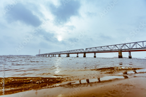 view of the railway bridge from the water near the river Bank © Лев Кирьянов