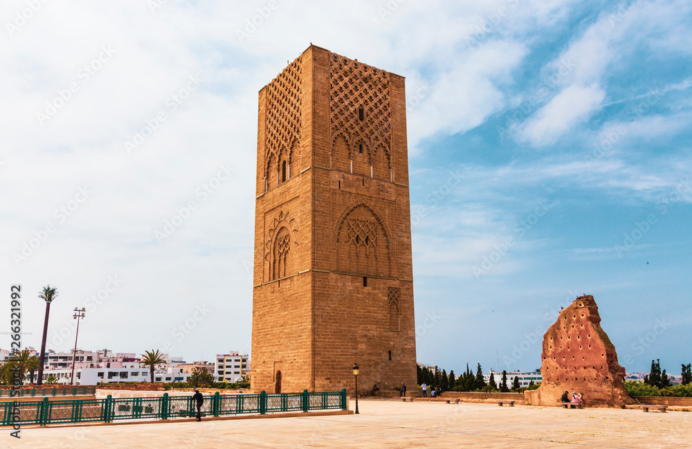 view of Tour Hassan tower against blue sky - Hassan Tower or Tour Hassan is the minaret of an incomplete mosque in Rabat, Morocco