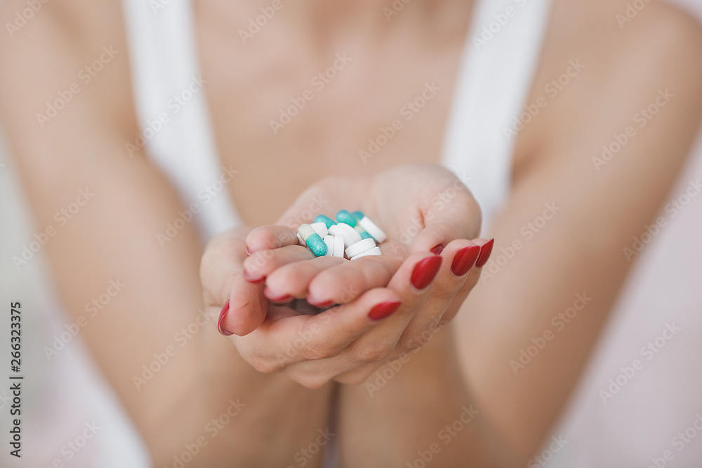 Close up picture of pills. Young woman taking pills Close up picture of pills. Young woman taking pills