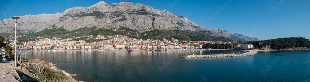 City of Makarska and calm blue sea panorama