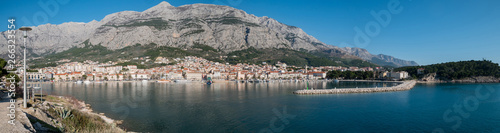City of Makarska and calm blue sea panorama
