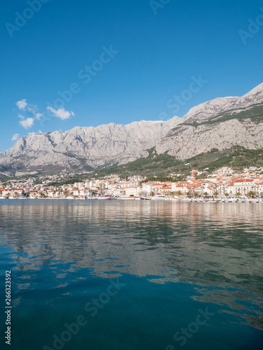 Calm blue sea and city Makarska in Croatia