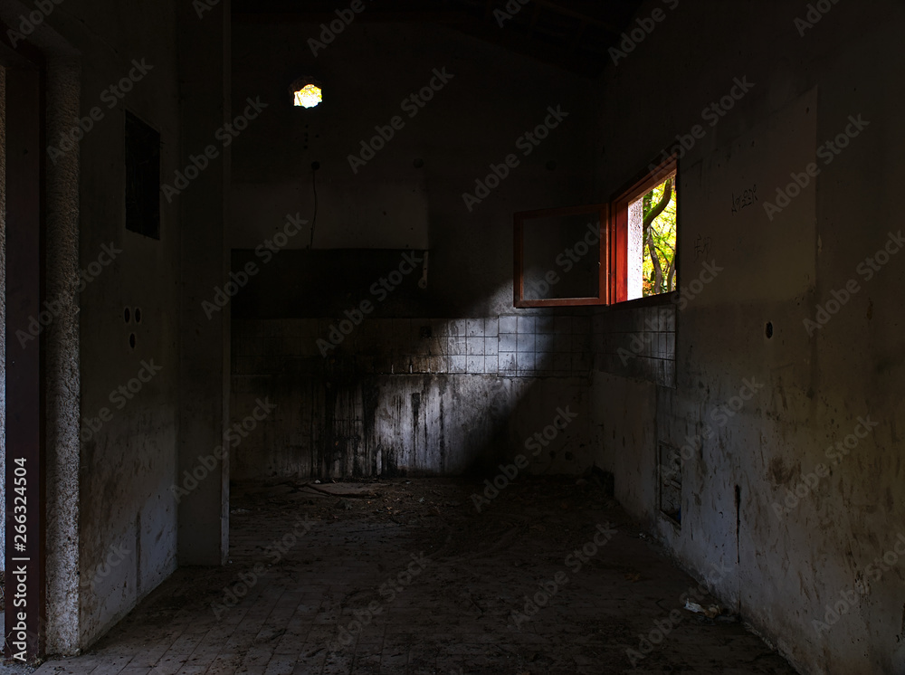 Beautiful autumn view from abandoned building window. Vibrant landscape nature colors, contrasts with pale dark building interior. Beautiful autumn view from abandoned building window. Vibrant landscape nature colors, contrasts with pale dark building interior.