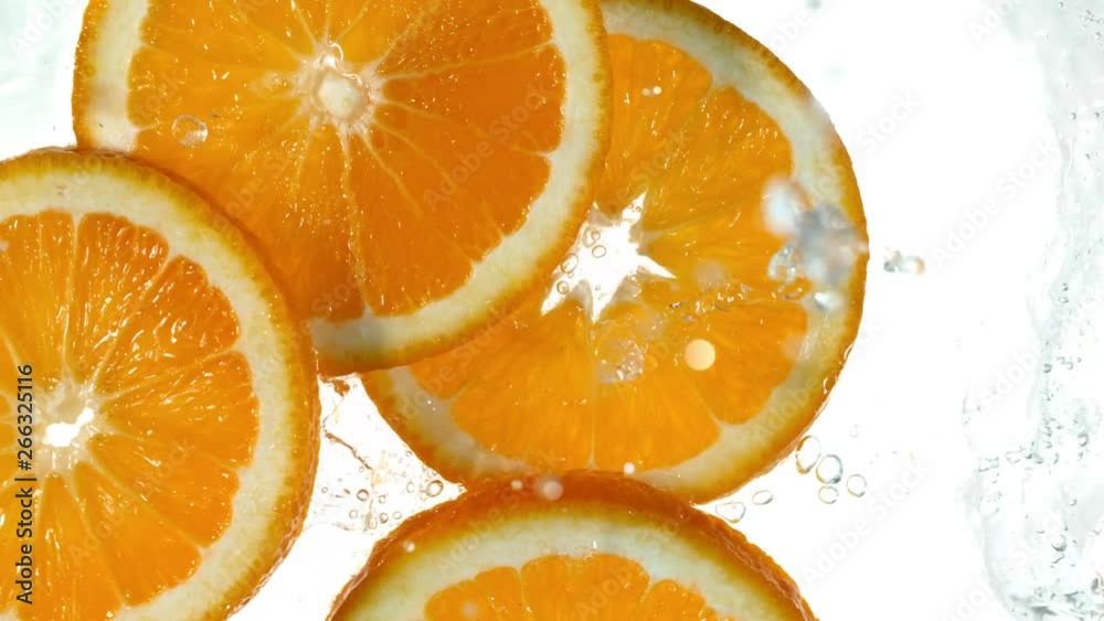 Super slow motion of orange slices with water splash. Filmed on high speed cinema camera, 1000 fps. Super slow motion of orange slices with water splash. Filmed on high speed cinema camera, 1000 fps.