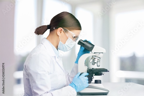 Young male scientist Working with Microscope