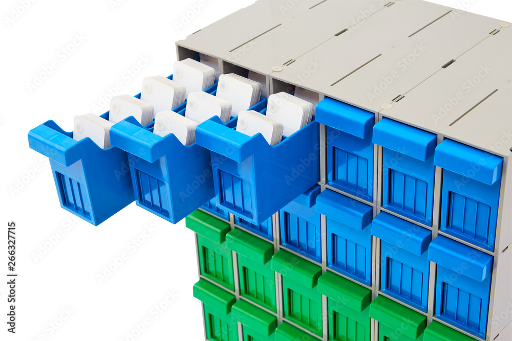 Fototapeta premium Green and Blue Plastic storage bins for screws and bolts on white background