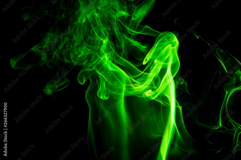 Fototapeta premium Green smoke on black background