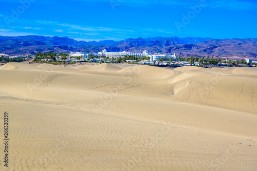 Aerial View of Sand Dunes in Gran Canaria with beautiful coast and beach, Canarian Islands, Spain © Simon Dannhauer