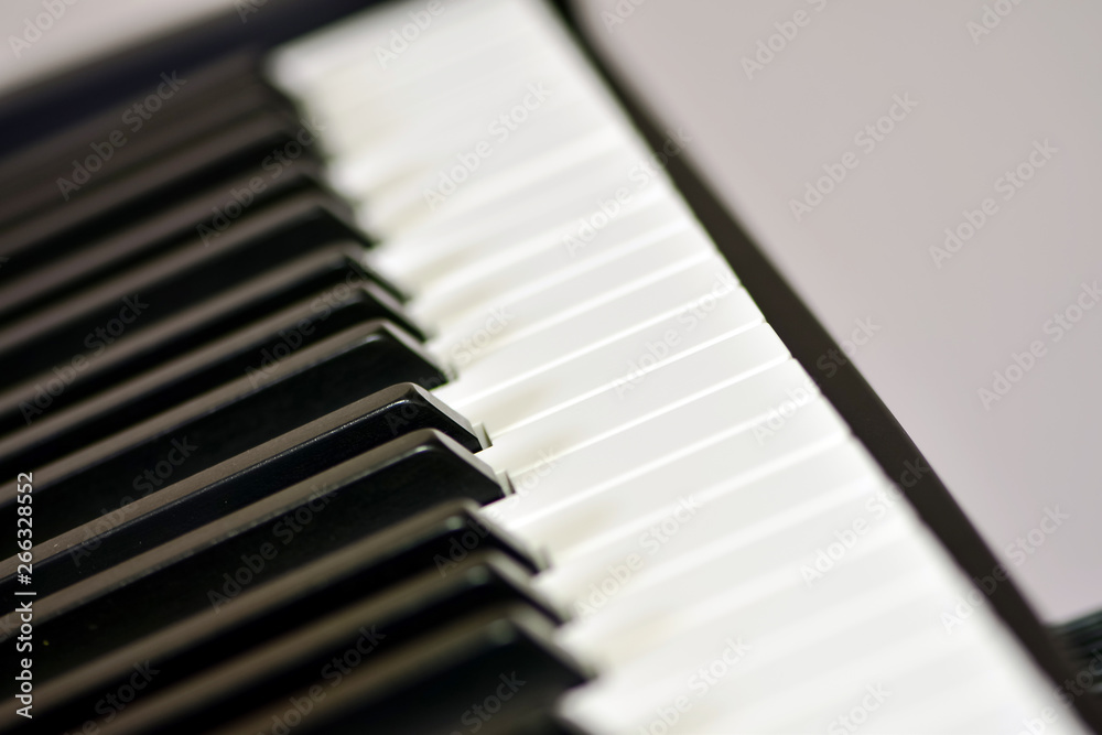 Keys of a digital piano, soft focusing, creative mood of a person improvisation and creativity. Midi piano keyboard for playing digital music and making remixes. Keys of a digital piano, soft focusing, creative mood of a person improvisation and creativity. Midi piano keyboard for playing digital music and making remixes.